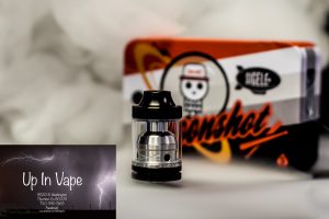 Sigelei Moonshot 200W Capable Two Post RTA by Suprimo Designed in Northern California The Sigelei Moonshot Two Post RTA is a compact rebuildable tank atomizer aimed directly at a recreating high powered RDA experience with the benefits of a tank reservoir, combining a wide surface area 13mm by 1mm dual adjustable airflow with dual 5mm diameter inner airholes, a two post build deck, a gold plated non redirected positive pin, and quad 3mm diameter wick ports that result in staggering overall capability. Designed to compete with high power capable RDAs, the Moonshot measures a compact 32mm from base to drip tip base, maintaining a well balanced profile. Using the wide area top fill system, users can easily fill the 2ml tank capacity. The Moonshot's build deck features a two post design with one 2mm diameter terminal per post, allowing for easy mounting of dual coil builds. Utilized in conjunction with the locking well, high power builds driven up to 200W can be achieved with steady wicking rates, as the Moonshot features quad 3mm diameter wicking ports. For maximum conductivity, a 24K Gold Plated Center Pin features a direct to contact design resulting in minimal voltage drop due to the lack of redirection of electrical current. The build deck and chimney system is designed to be smaller chambered than typical build decks, creating a higher level of flavor delivery. To feed the potential of the system, dual 13mm by 1mm airslots direct airflow into two 5mm diameter airholes located in the build deck, allowing for absolutely massive vapor production. The wide area airflow also delivers cooling to a wider surface area in the subdeck, effectively cooling the entire system. Combining the form factor and capability of a RDA with the reservoir of a tank, the Sigelei Moonshot 200W Two Post RTA by Suprimo is a high performance platform designed for extreme vapor chasing. Product Features: 22mm Diameter 2ml Tank Capacity Dual Adjustable Airslots 13mm by 1mm Each Airslot 5mm Diameter Inner Bottom Airflow Active Cooling Wide Surface Area Cools Entire Subdeck and Deck of RTA Two Post Built Deck Single Terminal Design 2mm Per Terminal Direct to Contact 24K Gold Plated 510 Non Redirected Superior Conductivity Minimal Voltage Loss Quad 3mm Diameter Wick Ports Flow Precision Achieves Optimal Liquid Flow Internal Cutouts Lock Sleeve Into Place Small Chambered System Maximum Flavor PEEK Insulator Threaded Top Fill System Dual Wide Area Fill Ports 9mm Diameter Competition Bore Delrin Drip Top 32mm Height from Base to Drip Tip Base High Quality Stainless Steel and Glass Construction Product Includes: One Sigelei x Suprimo Moonshot 200W Capable Two Post RTA Additional Glass Tank Section Additional Hex Keys, Screws, and O-Rings Stylized Tin Packaging Warning: Never use a short or flat 510 connection on any hybrid or hybrid style device. If unsure whether this pertains to your particular set-up, DO NOT assemble and use. Always use proper precautions and handling. Advanced User Item. Use At Your Own Risk! Vape Denver